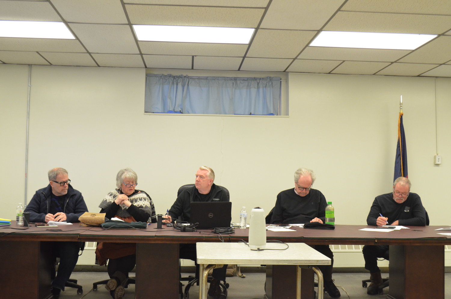 The Tusten Town Board, with board member Greg Triggs, left; board member Jane Luchsinger; town supervisor Ben Johnson; board member Kevin McDonough; and board member Bruce Gettel, in discussion at a March 14 town board meeting.